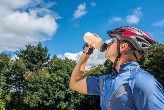 Cyclist drinking a fitness drink