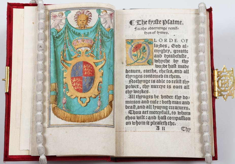 An open book with pearl placeholders, showing the title page of Psalms and Prayers.