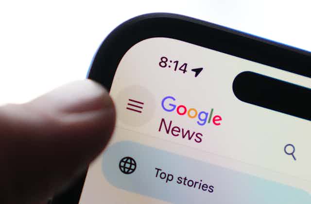 A closeup of a smart phone with displaying Google News