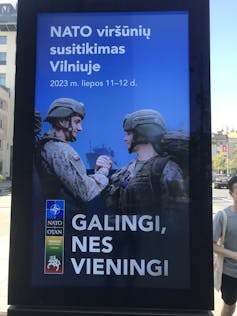 Poster showing Nato soldiers to promote the summit in Vilnius in July 2023.