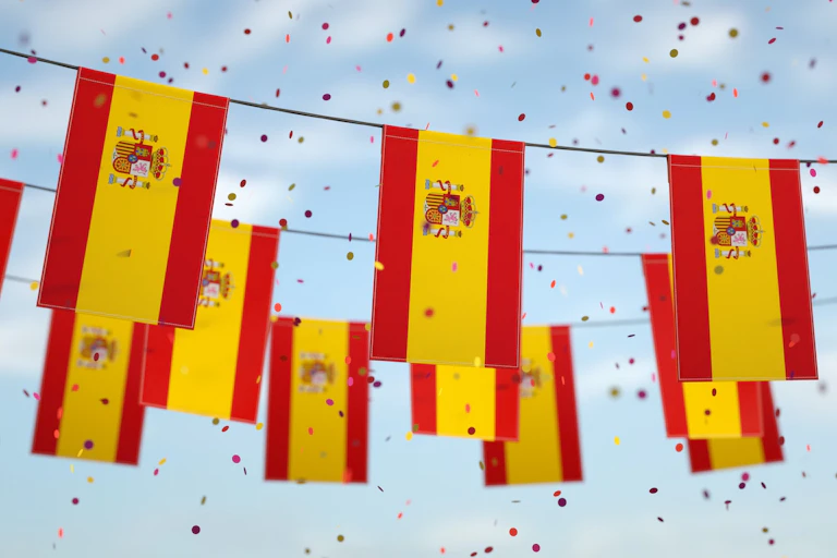 Spanish flags hanging from a cord.