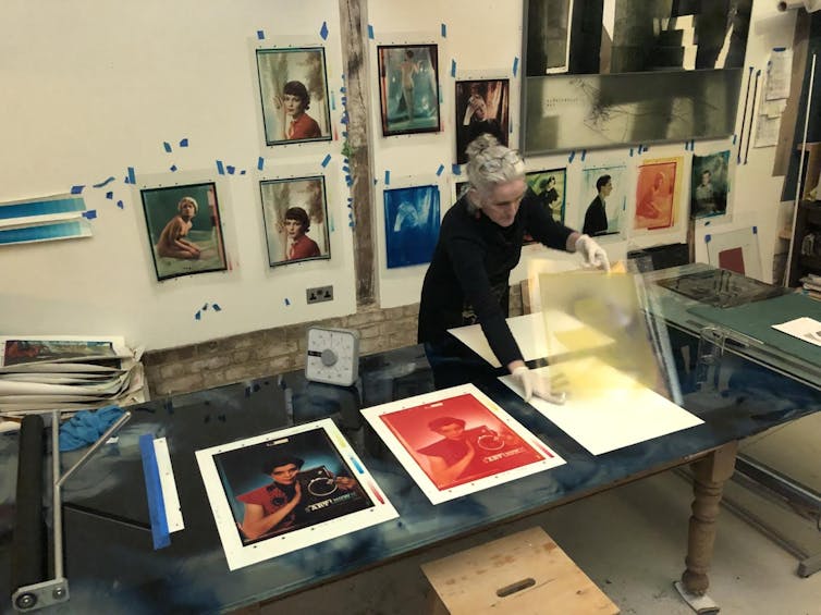 Katayoun Dowlatshahi working on large colour prints.