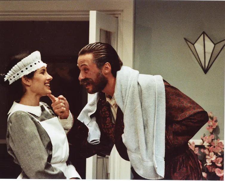 A maid and a man.