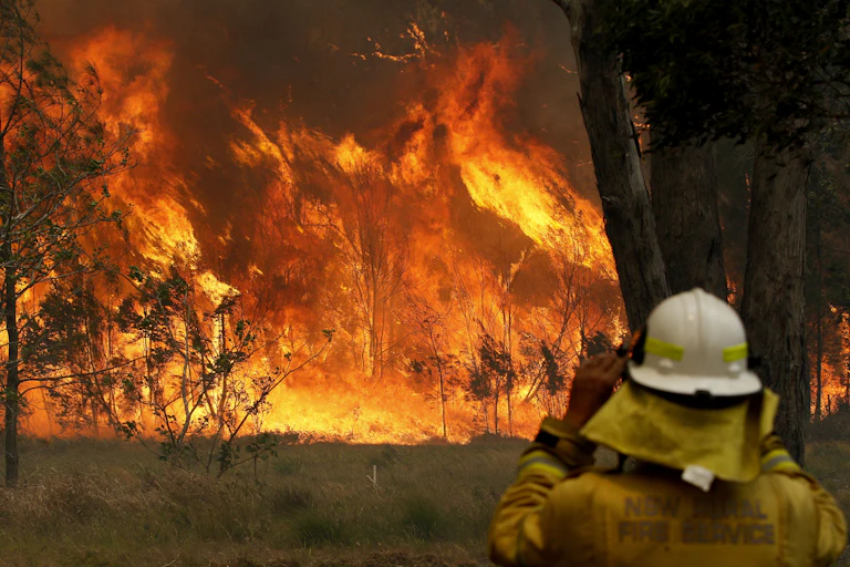 firefighter watches fire
