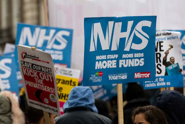Banners from a save the NHS march