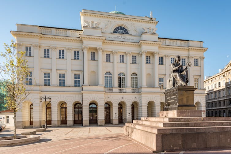 A large white stone building.