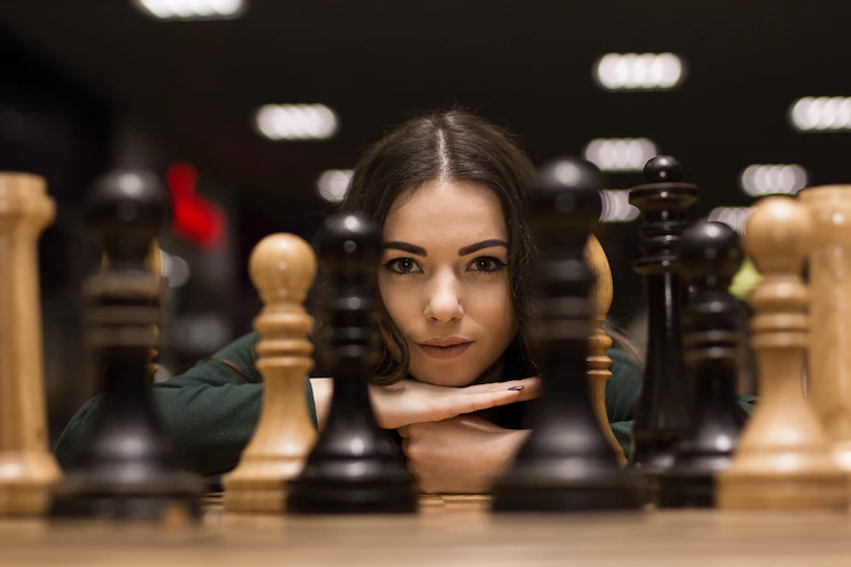 Woman with chess pieces