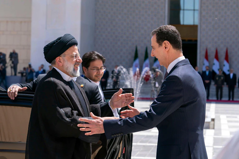 Syrian president Bashar al-Assad greets Iranian president Ebrahim Raisi in Damascus, May 2023
