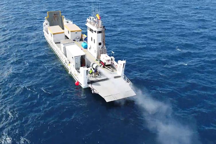 Sea water droplets being sprayed into the air above the Great Barrier Reef in a world-first trial of 'cloud brightening' by SIMS and Southern Cross University.