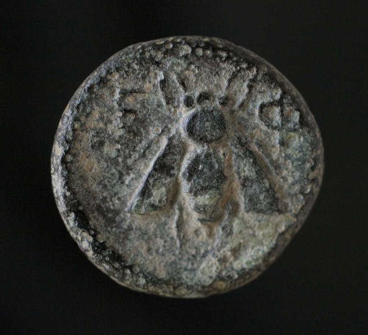 A bronze coin minted in Ephesus, dated between 202BCE and 133BCE, featuring a honeybee.