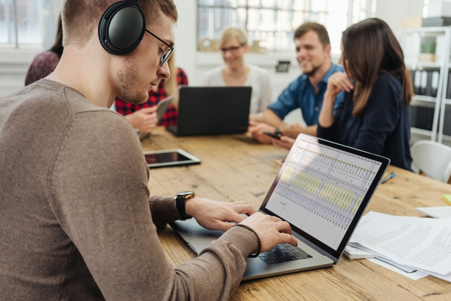 Workers hate office noise but is using headphones to shut out