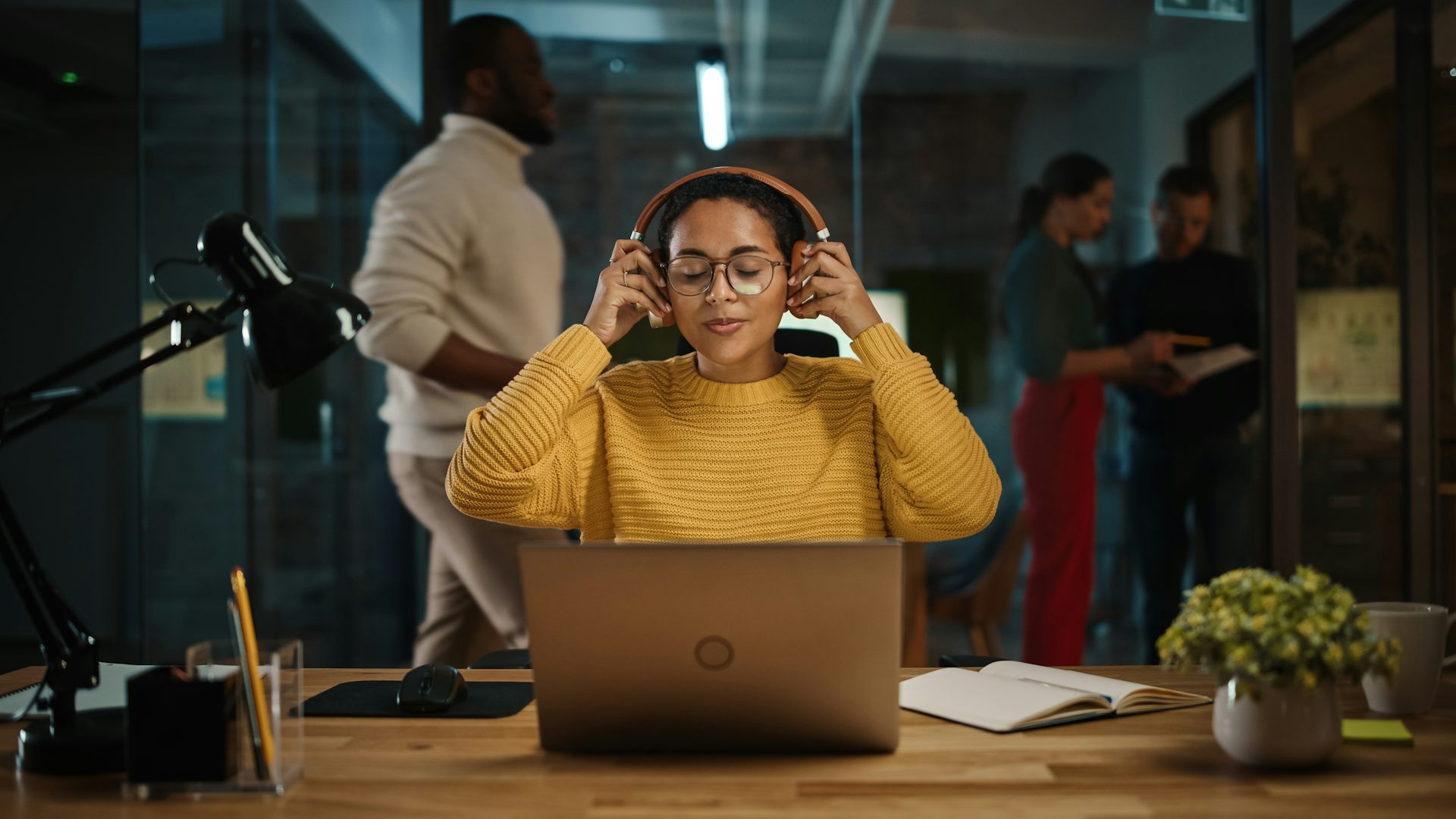 Workers hate office noise but is using headphones to shut out