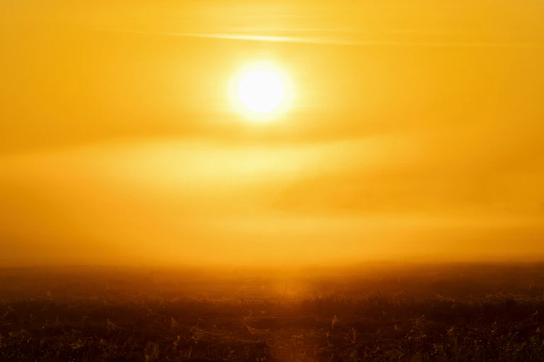 A bright sun above the ocean