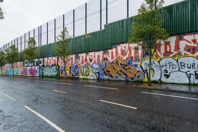 A wall covered in graffiti.