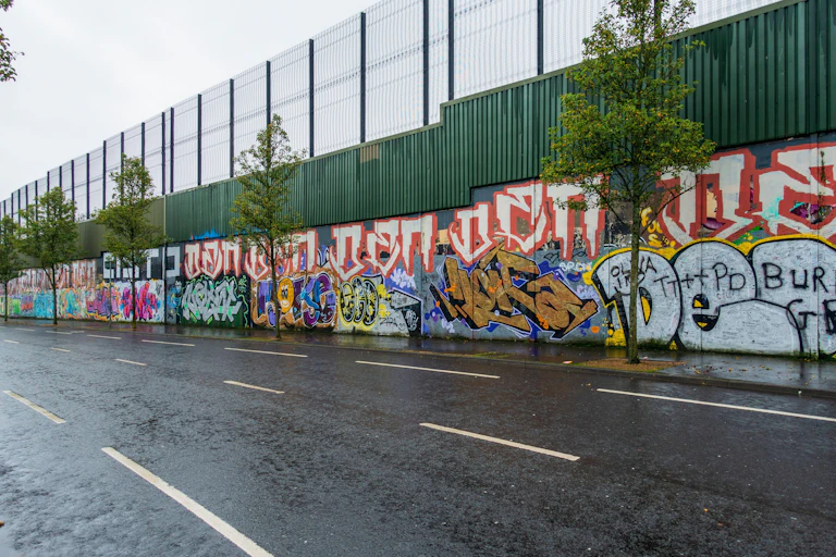A wall covered in graffiti.