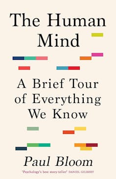 Book cover with writing and coloured squares.