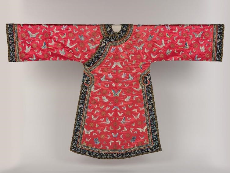A red 19th-century Chinese woman's robe, edged in black.