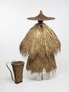 Chinese straw-like outfit with wide-brimmed hat for working in the rain.