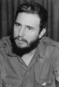 A black and white photograph of a bearded Fidel Castro.