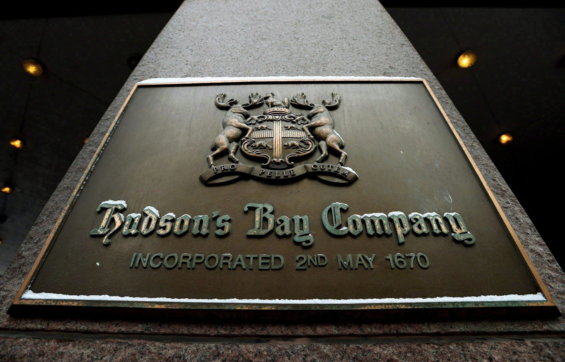 A brass Hudson's Bay Company logo seen outside one of its stores