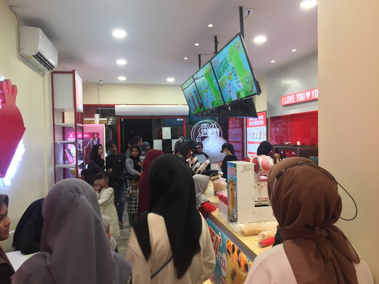 Consumers are queuing in a Mixue outlet in Batam, Riau Islands, Indonesia.
