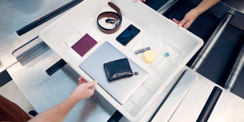Why do I have to take my laptop out of the bag at airport security?
