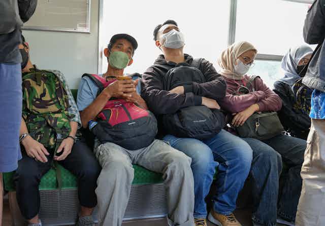 Commuters dozing off on a train
