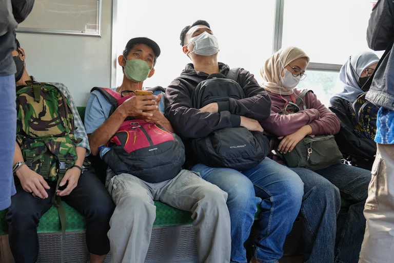 Commuters dozing off on a train