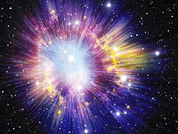 An image showing a burst of light and color against black space and stars.