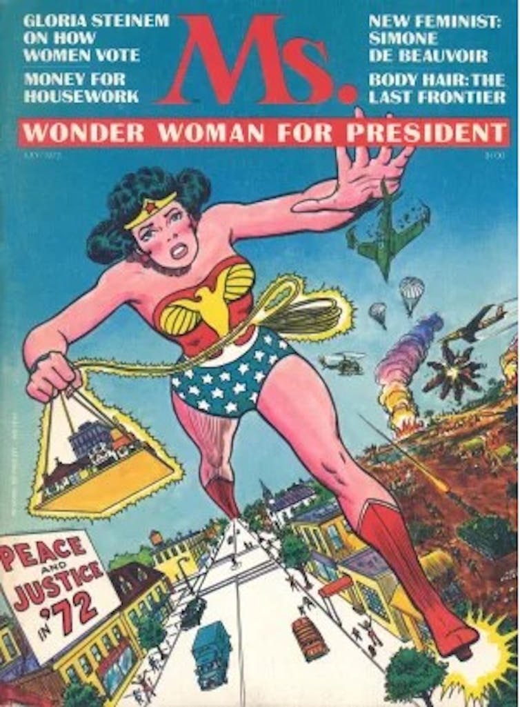 Giant Wonder Woman runs through a chaotic city street next to one of her presidential campaign signs