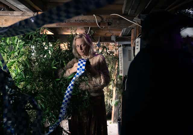 Marta Dusseldorp as Stella holds police tape