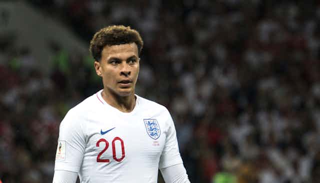 Dele in his white England kit, playing as number 20.