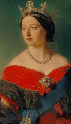 Painting of Queen Victoria wearing crown with an off-shoulder gown held in place by the Koh-i-noor as a brooch.