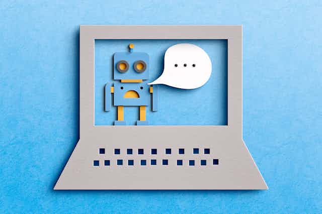 A cartoon image of a stylized laptop with a robot on the screen and a speech bubble coming from the robot's mouth