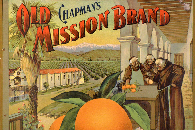 Three monks stand around a table with oranges outside a building with Spanish columns and a large orange grove in the background and snow-capped mountains beyond.