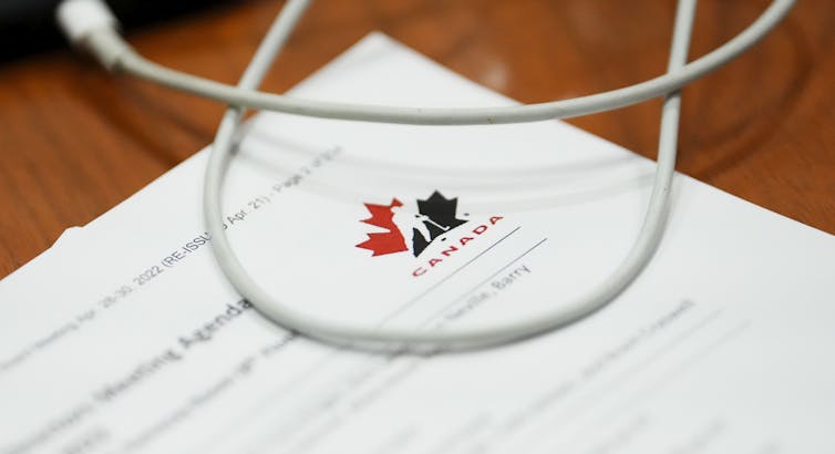 A blurred document with the Hockey Canada logo visible in the upper left hand corner