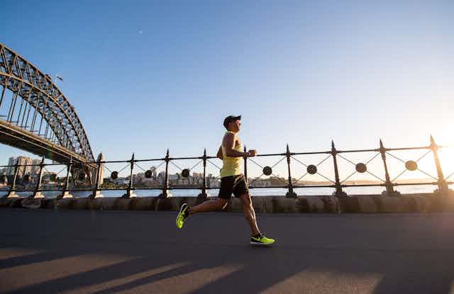 man runs near Sydney Harbour Bridge