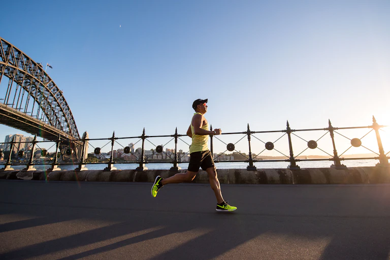 man runs near Sydney Harbour Bridge