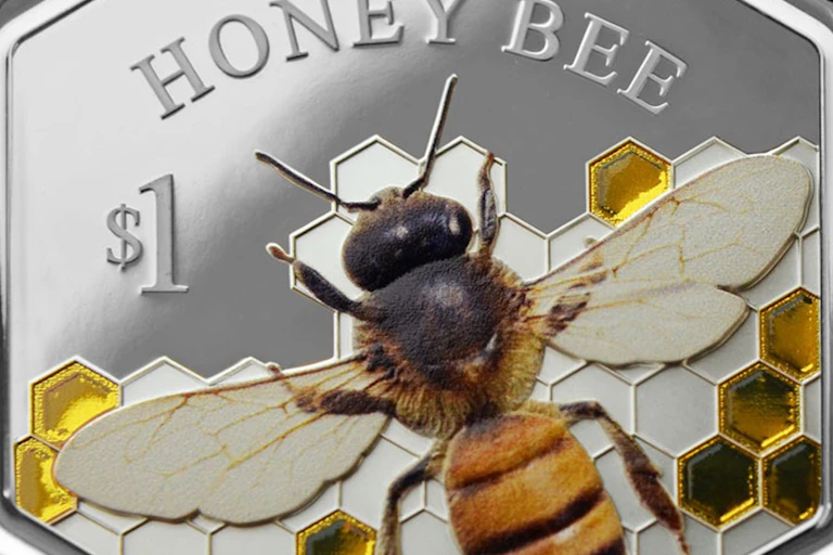A New Zealand hexagonal collectors' coin issued in 2016 featuring the honeybee.