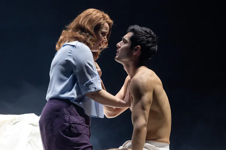 A man and a woman embrace.