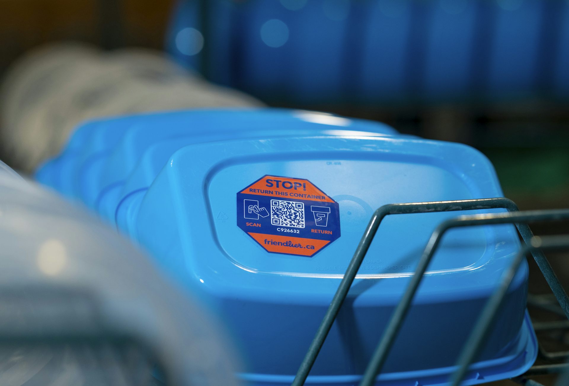 Racks of re-usable plastic food containers.