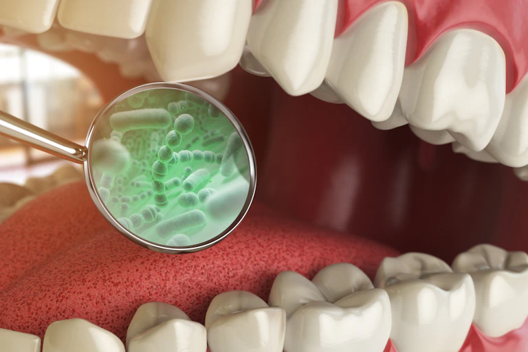 A digital drawing of an open mouth, with a dental mirror showing the bacteria inside it.