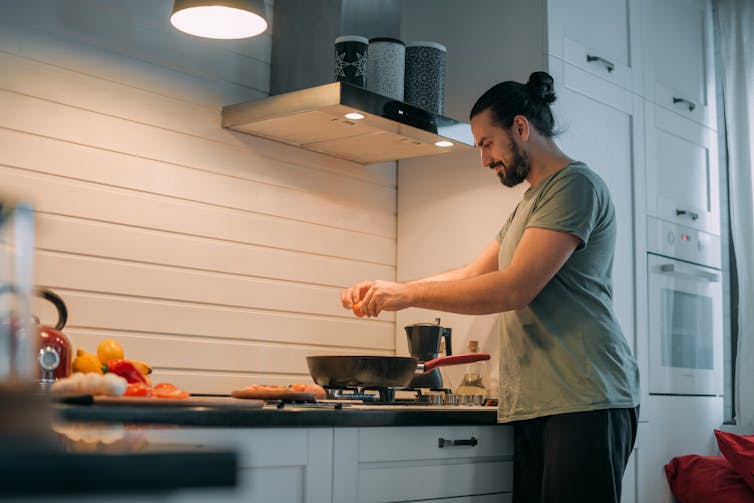 Man cooks meal