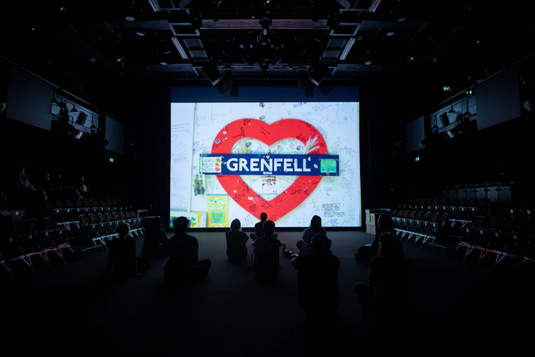 A screen at the back of a stage.