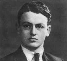 Portrait of a young man in jacket and tie.