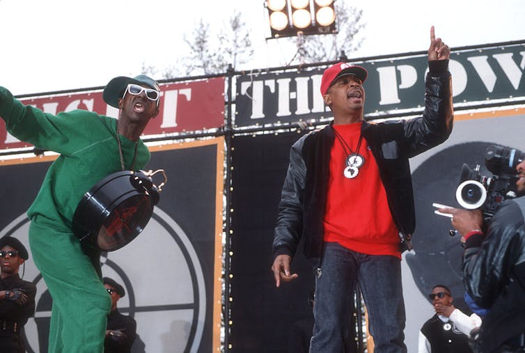 Rapper Flavor Flav and Chuck D film a music video.