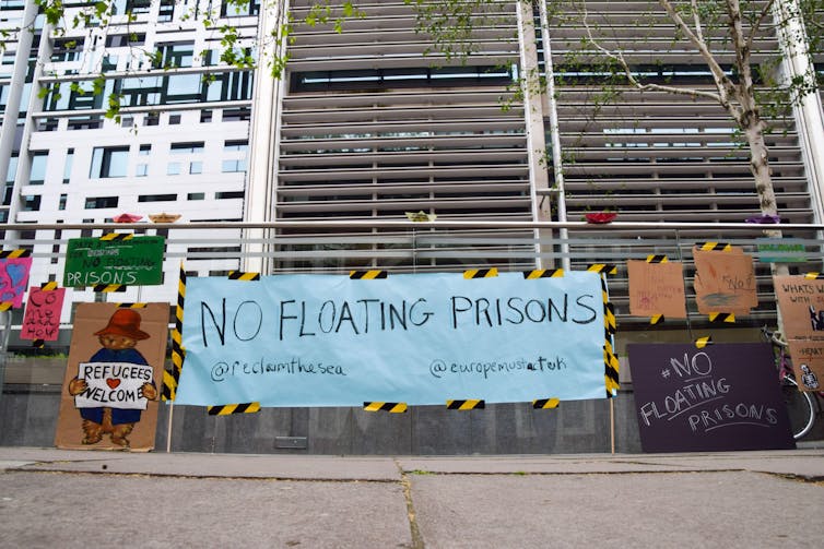 Posters on a fence.