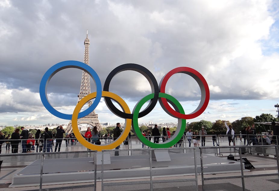 The Olympic Games' iconic rings are displayed by Paris's Trocadero Palace..