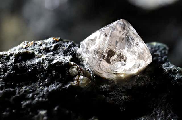 Uncut diamond nestled in kimberlite rock.