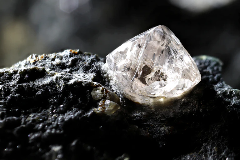 Uncut diamond nestled in kimberlite rock.